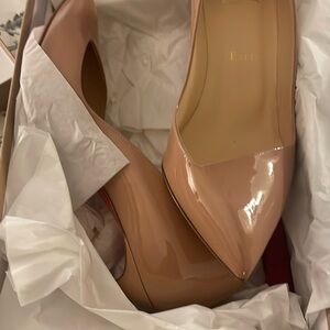 Christian Louboutin worn once, few scratches on the bottom of the shoe.